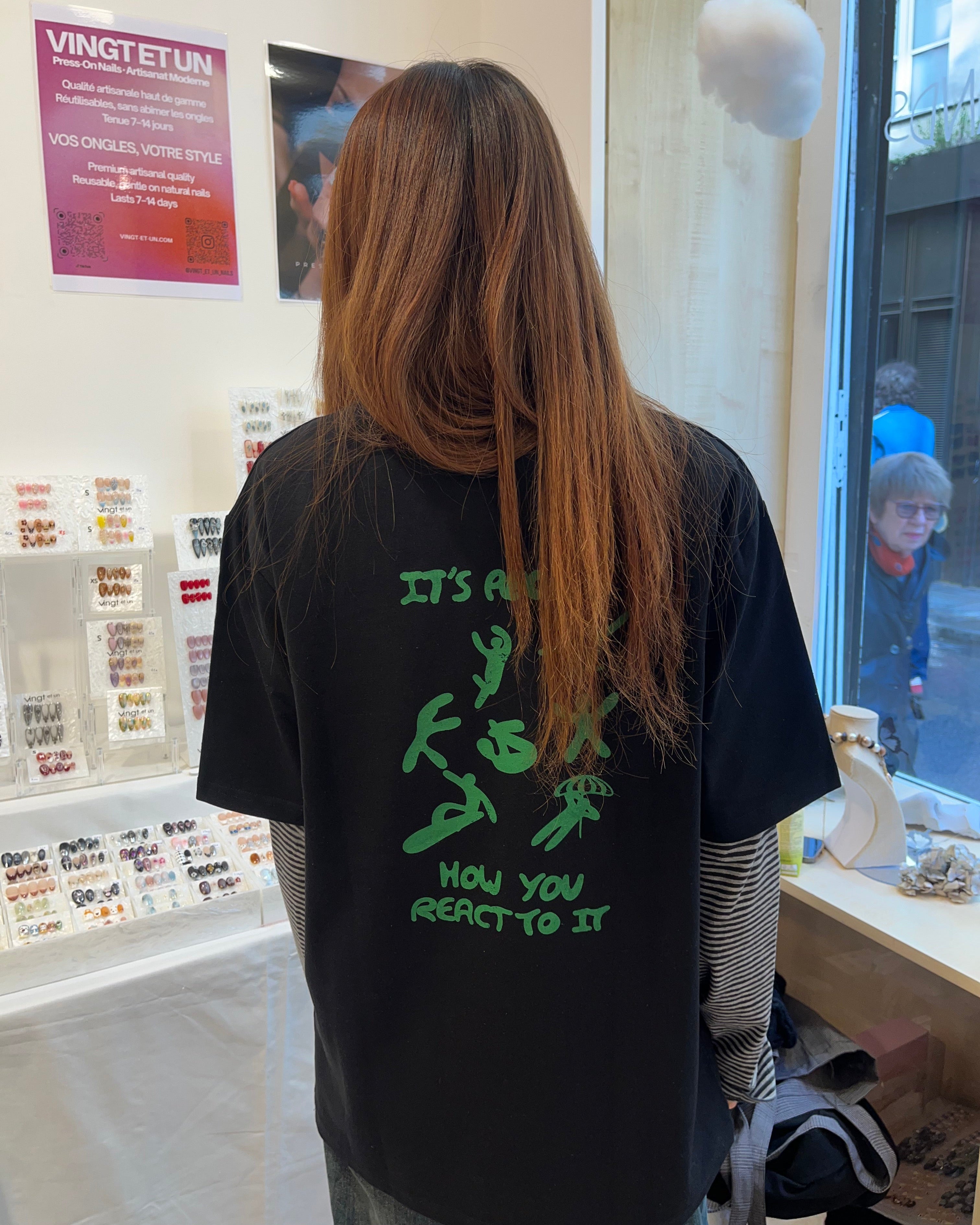 Participant wearing custom screenprinted black recycled t-shirt at UPWIND serigraphy event